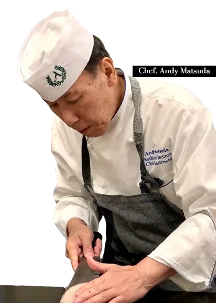 Chef Andy Matsuda in a white chef's jacket and hat