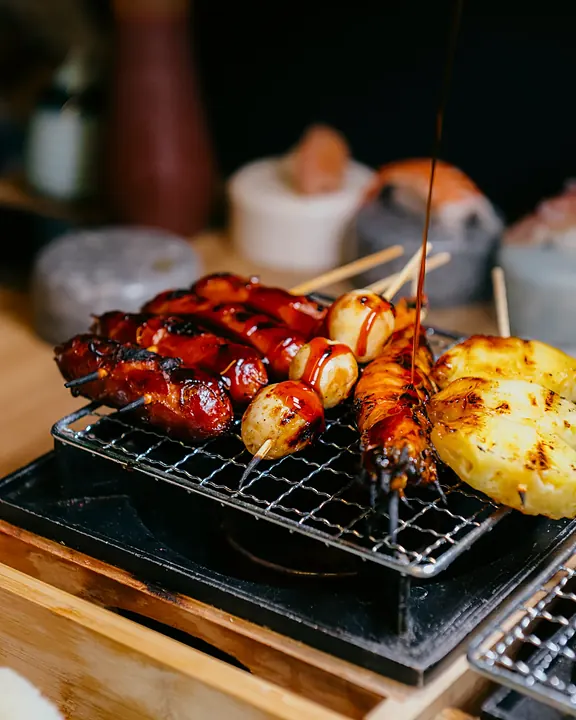 Skewers on a small tabletop grill