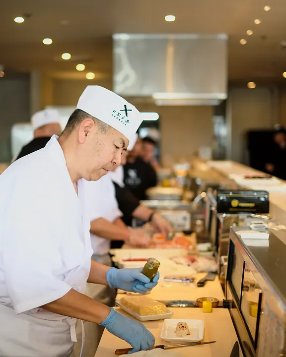 Chefs working at the sushi bar
