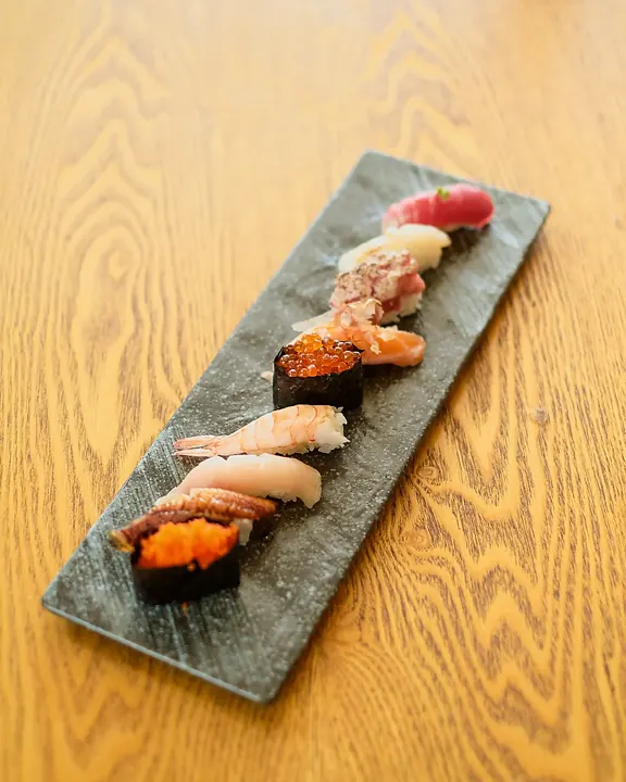 Assorted nigiri on slate