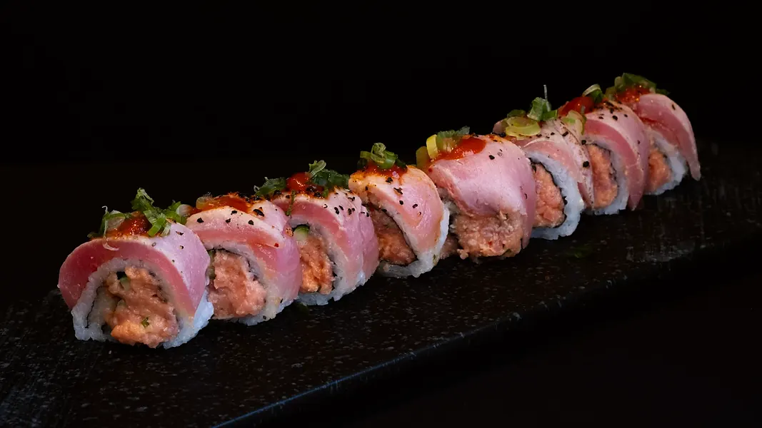 A seared roll with sauce