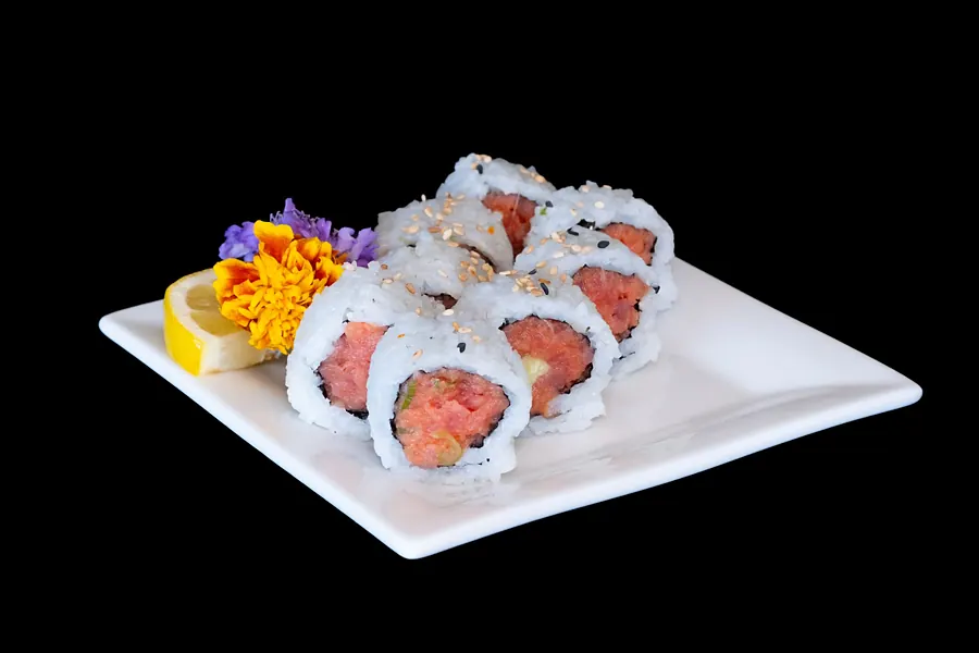 A sliced roll on a white plate