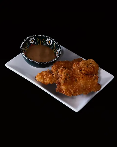 Fried pieces with a dipping sauce
