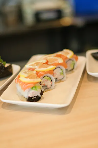 A roll topped with salmon