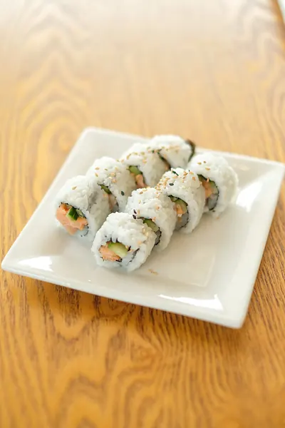 A plate of sliced rolls