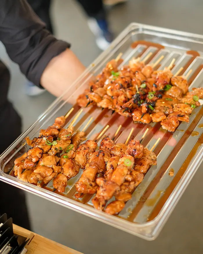 A tray of grilled skewers